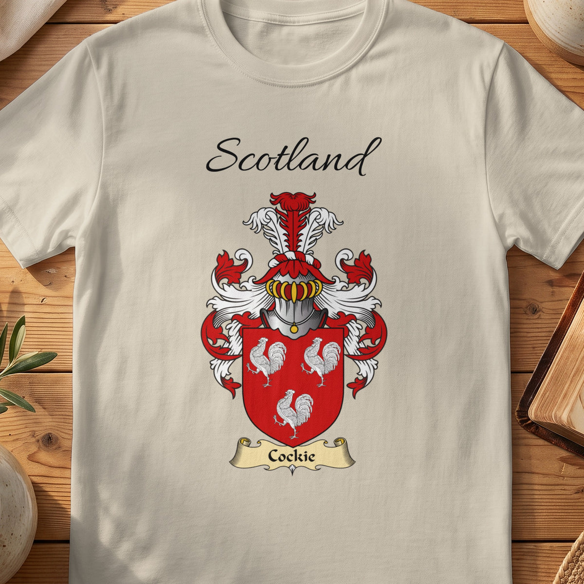 Sand Cockie Scottish family shield T-shirt featuring three white cockerels on red
