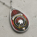 Cunningham clan Scottish tartan necklace with clan crest and Over Fork Over motto on tartan background