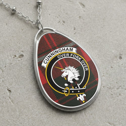 Cunningham clan Scottish tartan necklace with clan crest and Over Fork Over motto on tartan background