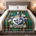 Sherlock family crest tartan blanket on a bed.
