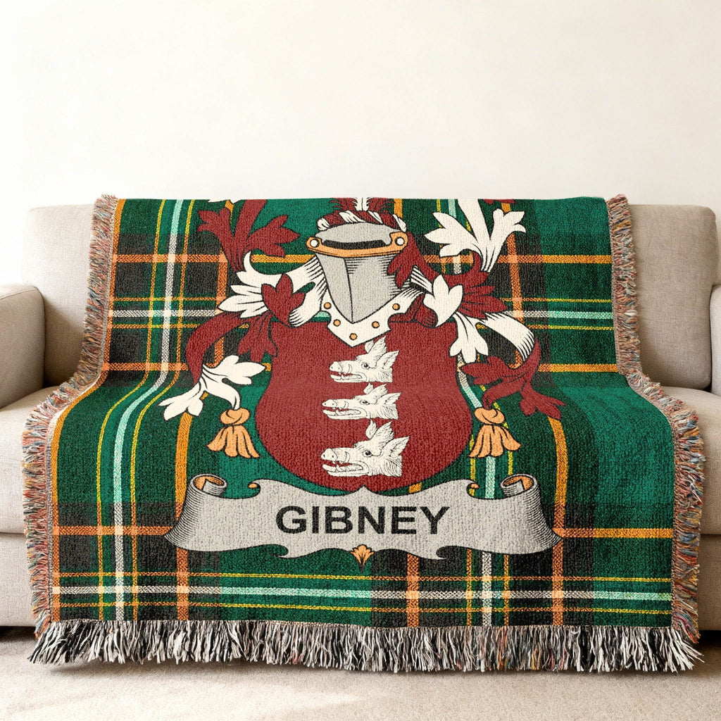 Green tartan throw blanket with Gibney family crest.
