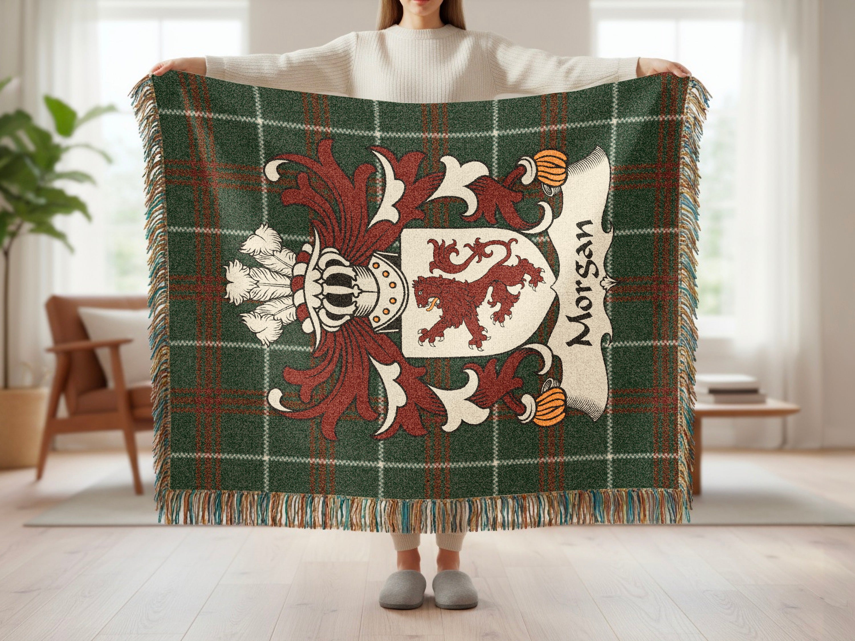 Green tartan blanket with Morgan coat of arms and name.