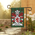Green plaid flag with Morgan crest featuring a lion, helmet, and feathers.