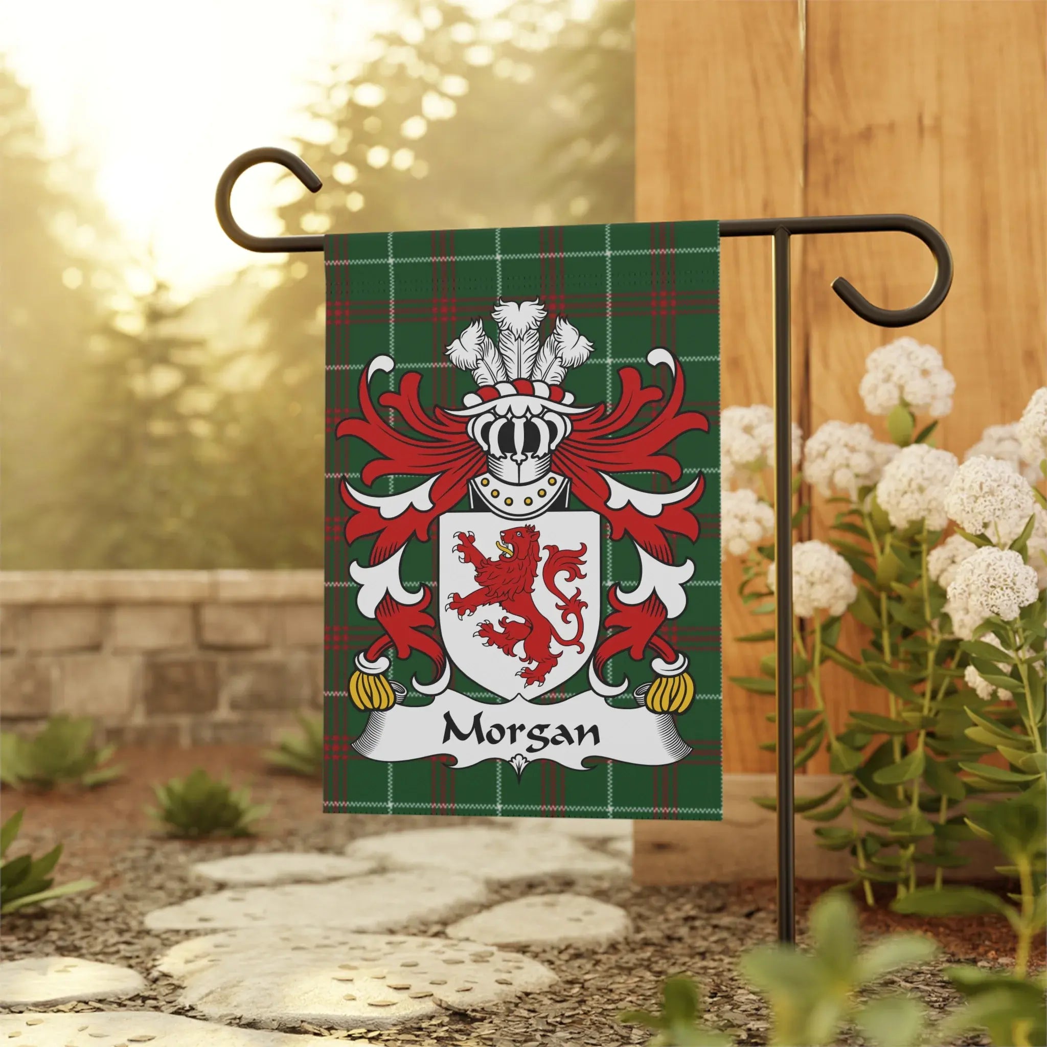 Green plaid flag with Morgan crest featuring a lion, helmet, and feathers.