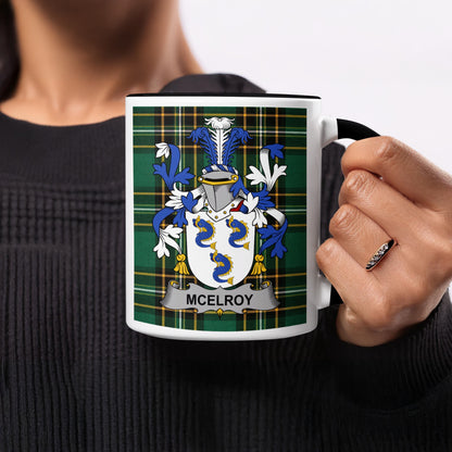 Mug with McElroy family crest on a tartan background.
