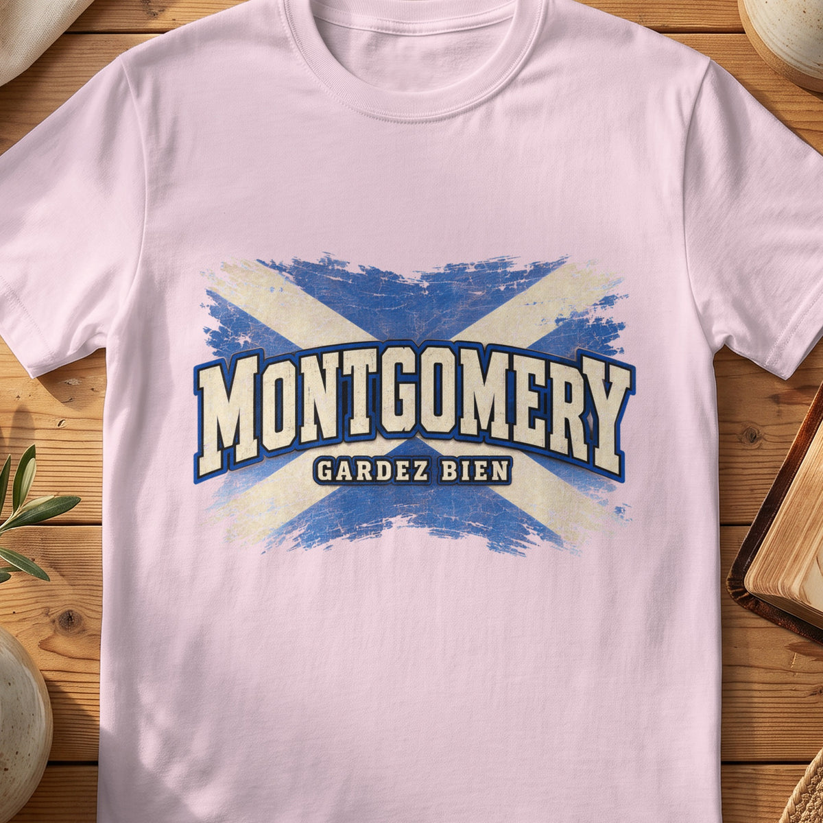 Montgomery Scottish Saltire T-shirt in Light Pink, with distressed blue and cream flag and “Gardez Bien” lettering.