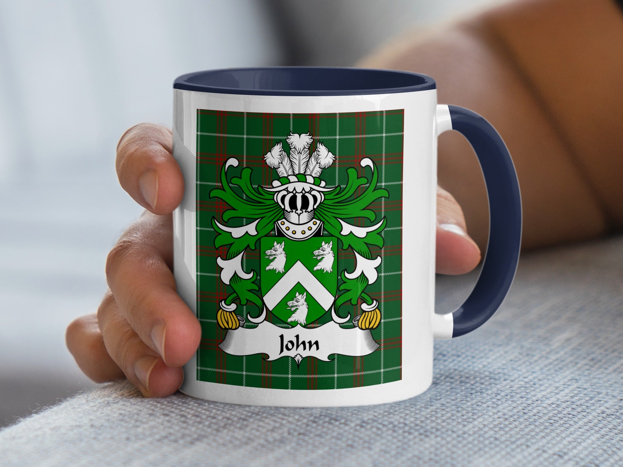 Mug with green tartan and crest displaying "John" on a banner.