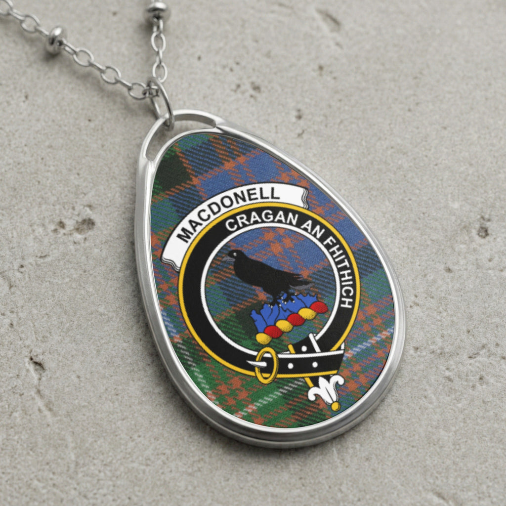 MacDonnell clan crest badge on tartan, with text "CRAGAN AN FHITHICH".