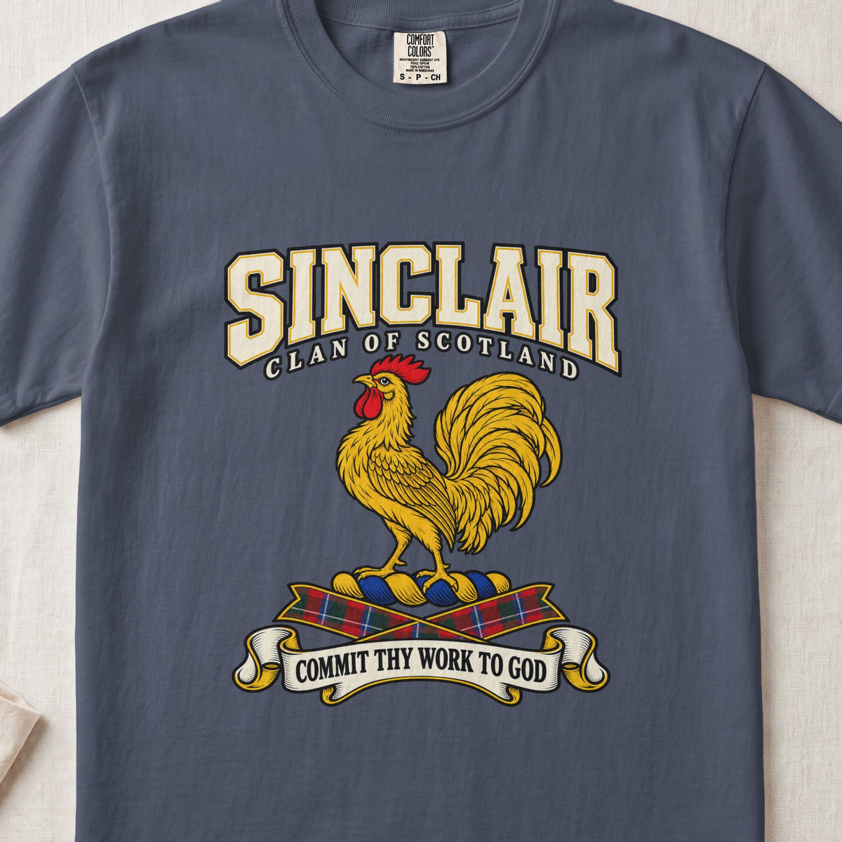 Sinclair graphic T-shirt in Midnight blue, front flat lay showing varsity lettering and gold rooster with red comb and wattle.