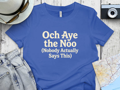 Blue t-shirt with "Och Aye the Noo (Nobody Actually Says This)" text.