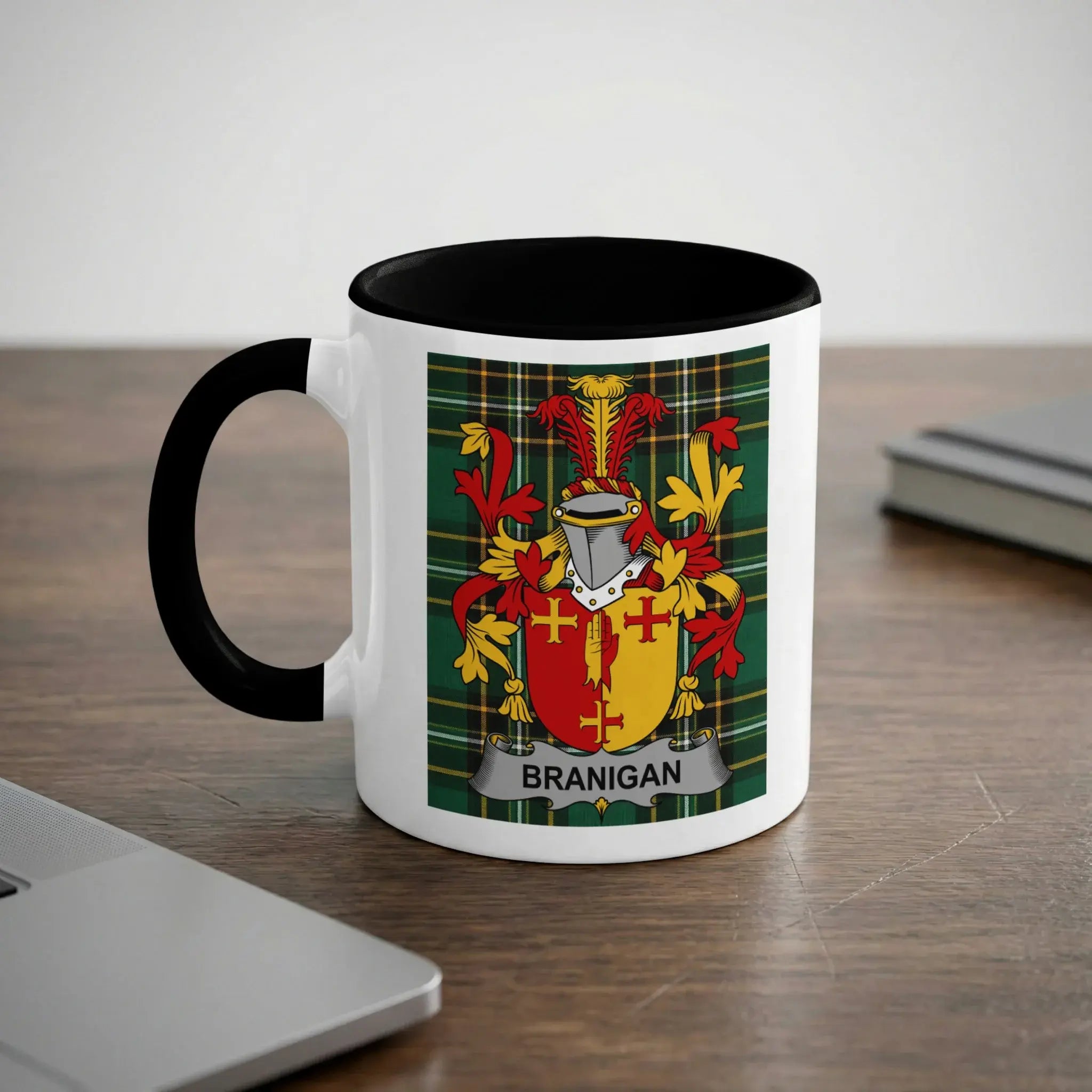 White mug with black rim, displaying the Branigan family crest on a tartan background.