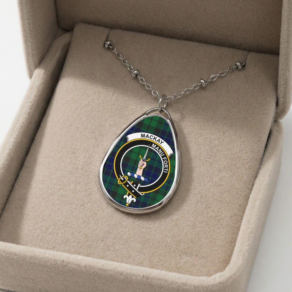 Oval pendant necklace with Mackay clan crest and motto "Manu Forti" in a velvet box.