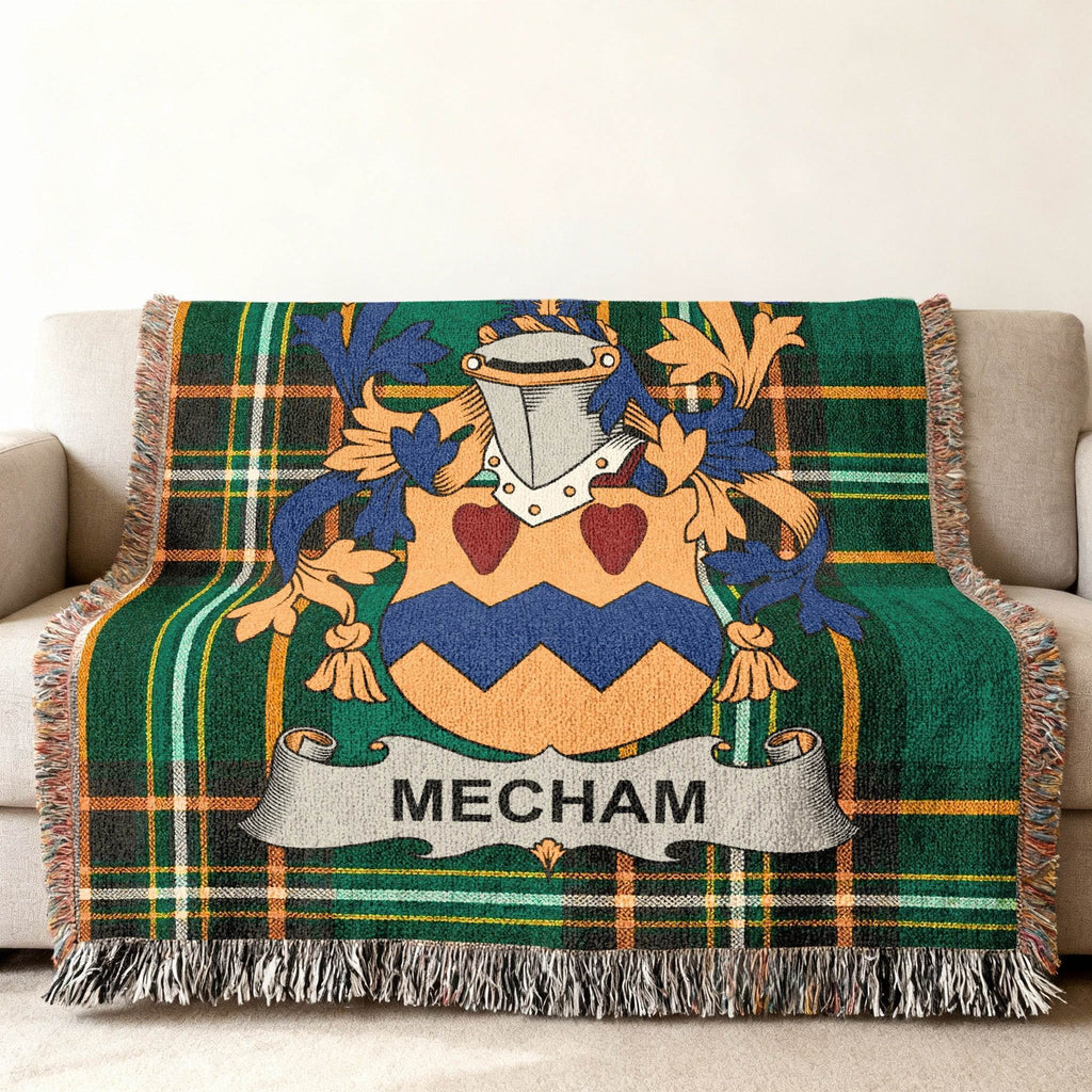 Woven throw blanket with green tartan pattern and a Mecham family crest.