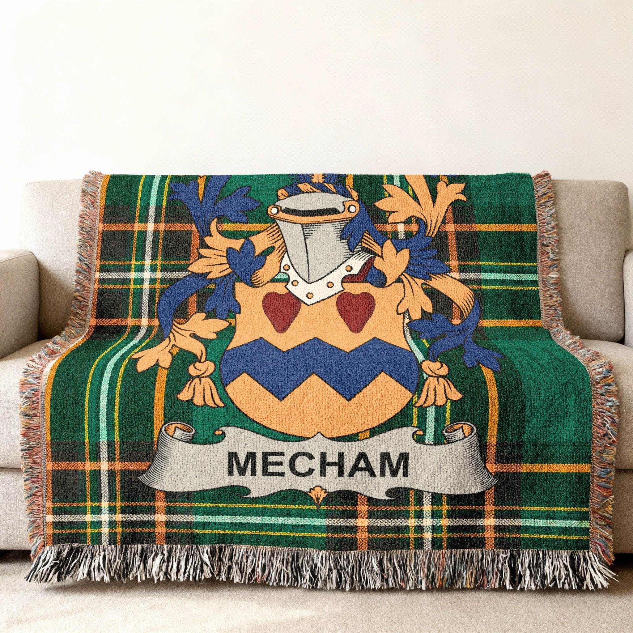 Woven throw blanket with green tartan pattern and a Mecham family crest.
