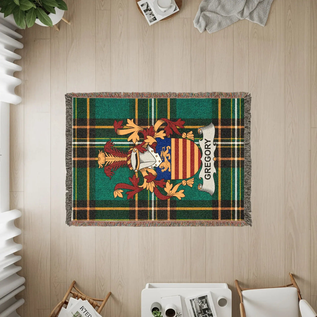 Green plaid throw rug with the Gregory family crest.