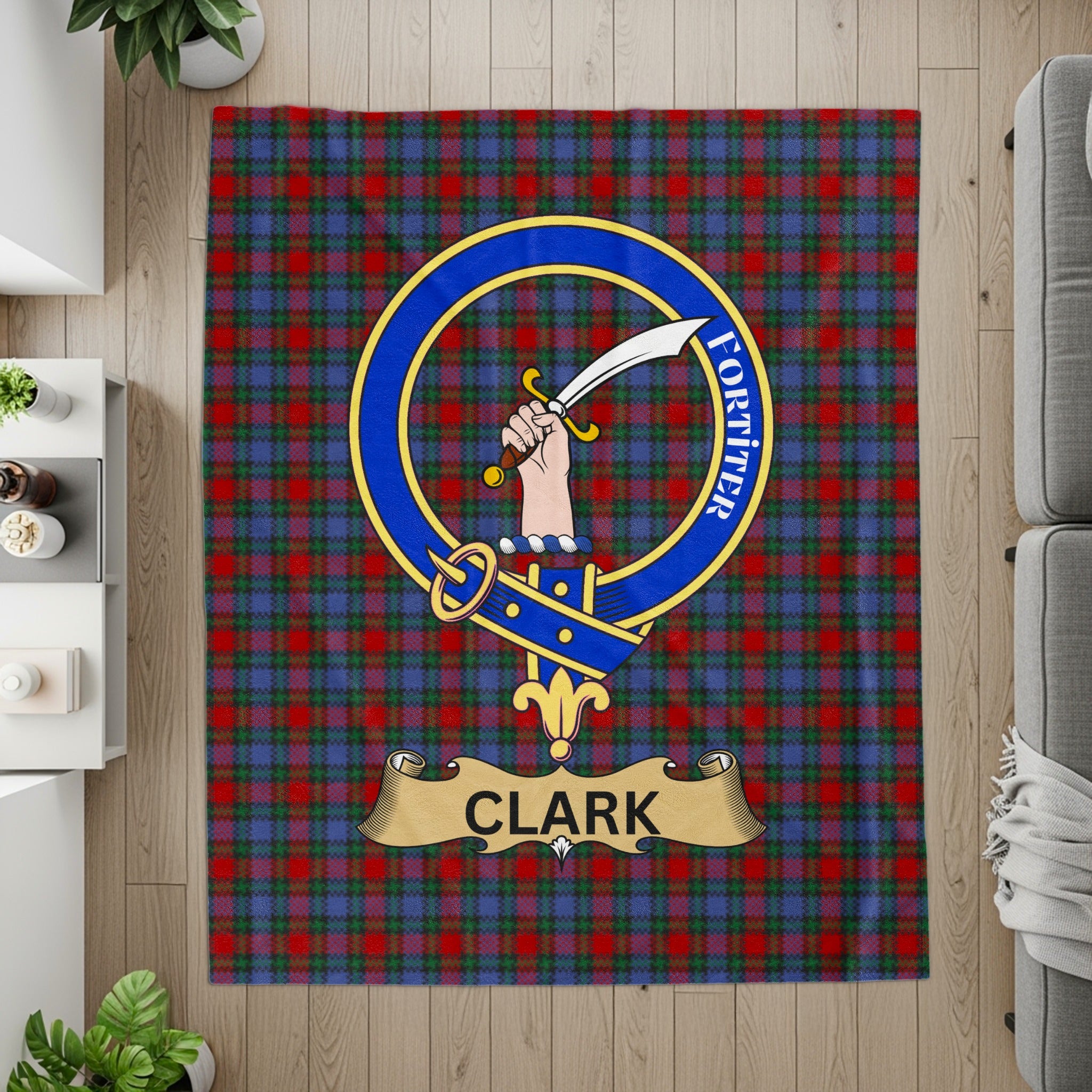 Clark crest and name scroll on tartan printed throw — flat lay detail
