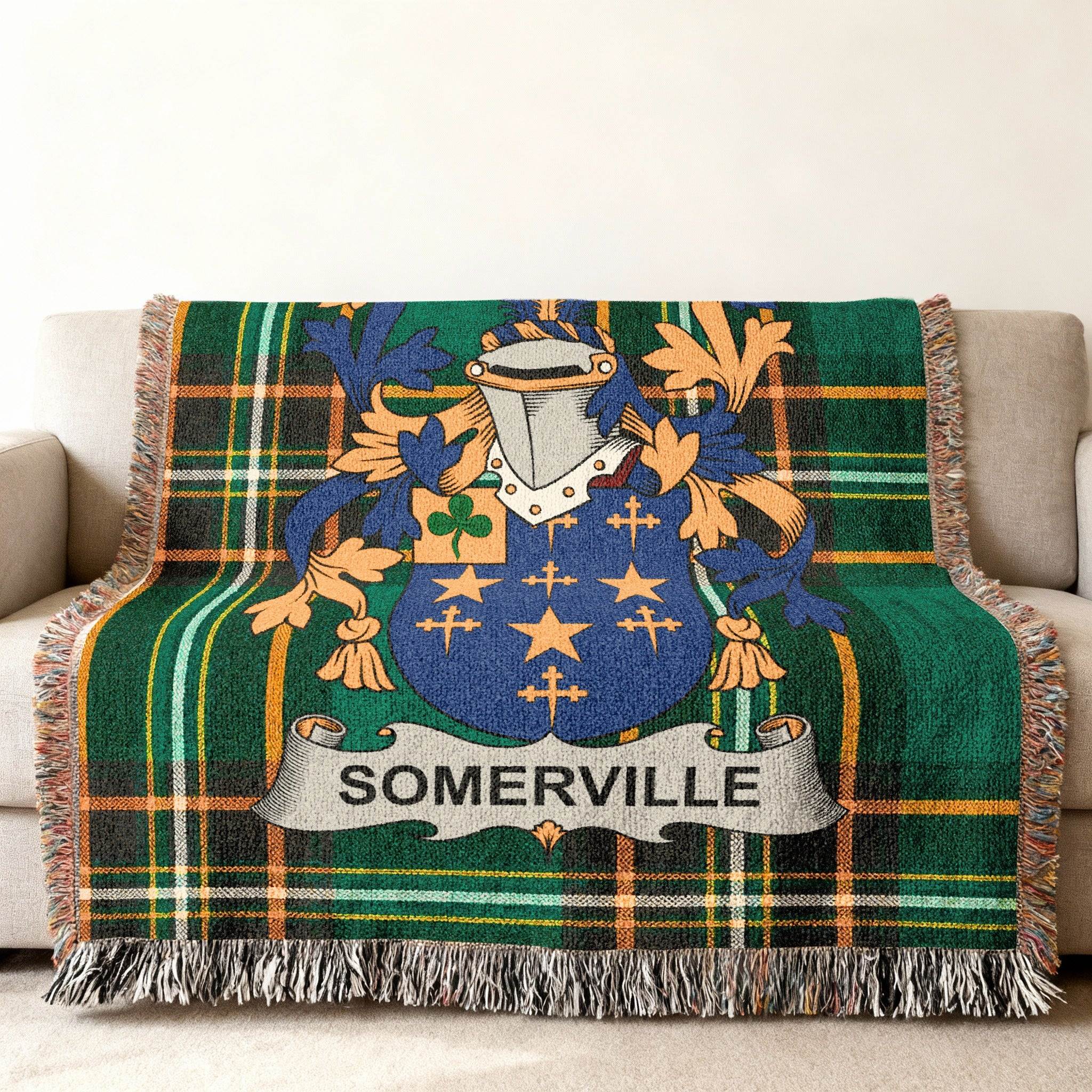 Somerville family crest on a green tartan plaid throw blanket.