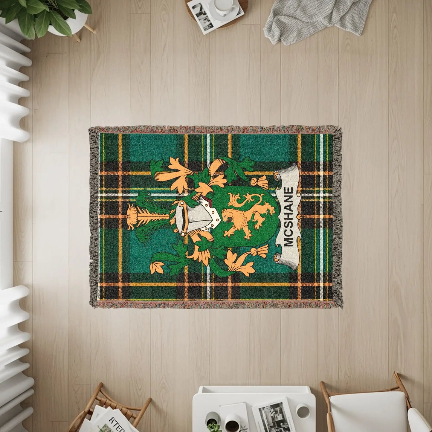 McShane family crest on a woven tartan throw blanket.