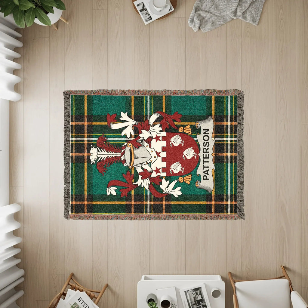 Woven throw blanket featuring the Patterson family crest and tartan pattern.