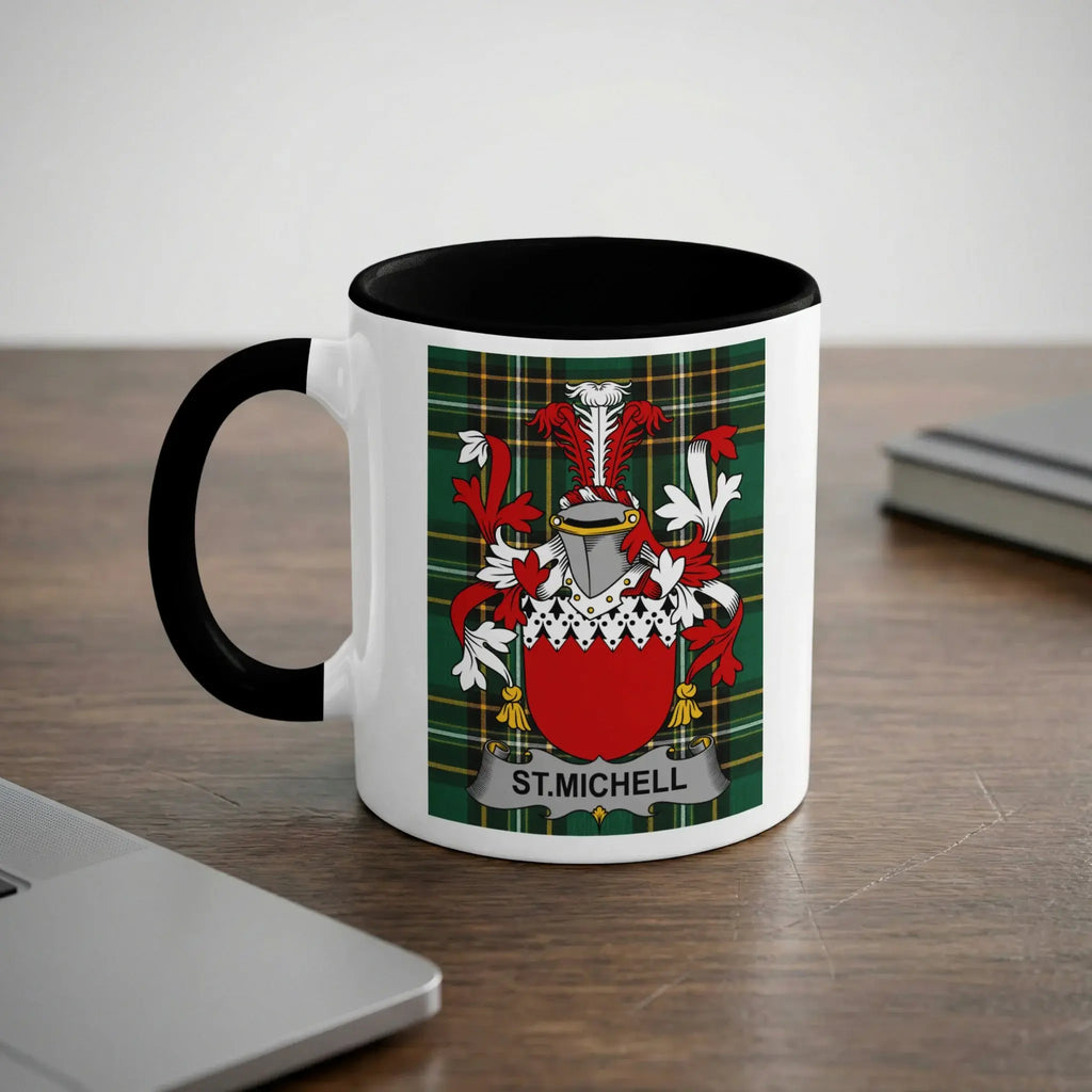 White mug with black rim featuring a green plaid crest with "ST. MICHELL" text.