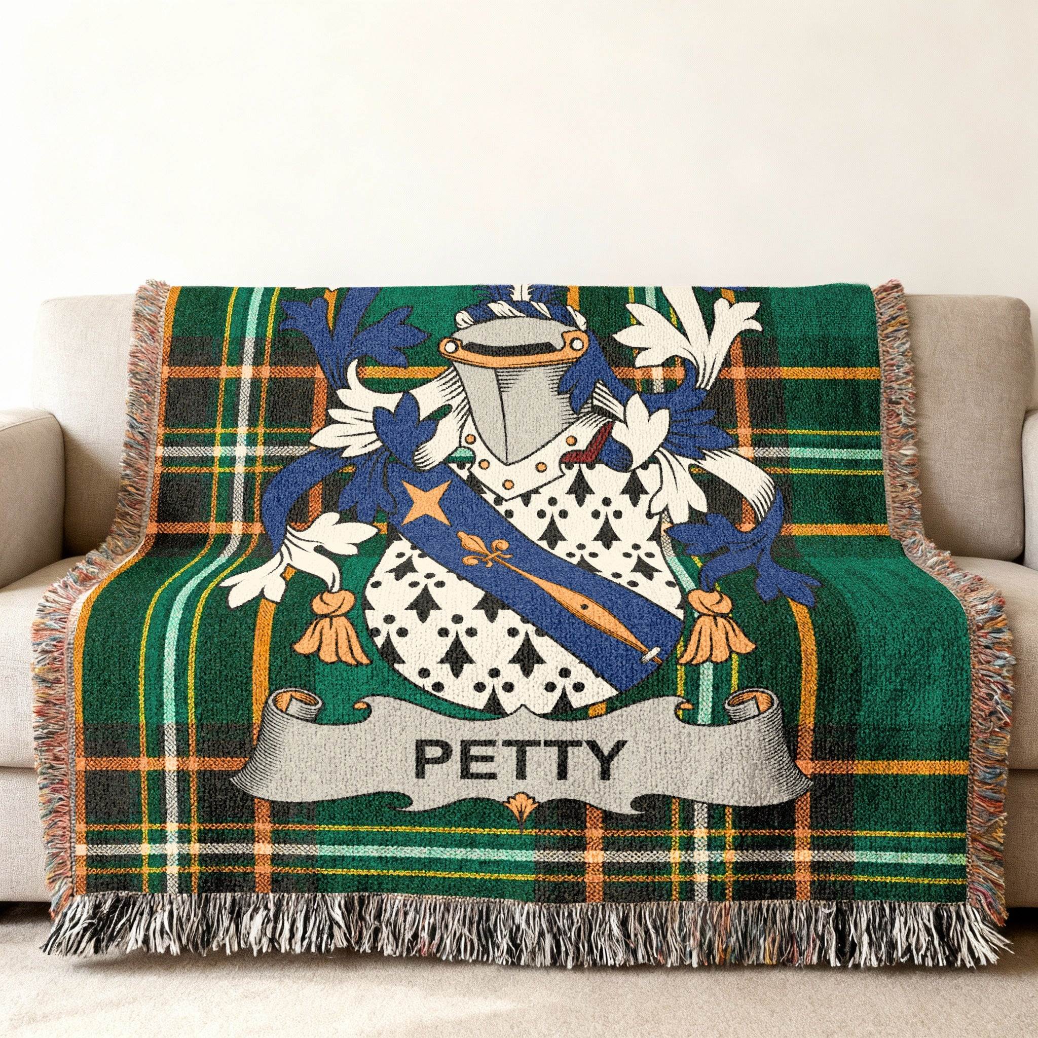 Green plaid throw blanket featuring a Petty family crest with shield and banner.