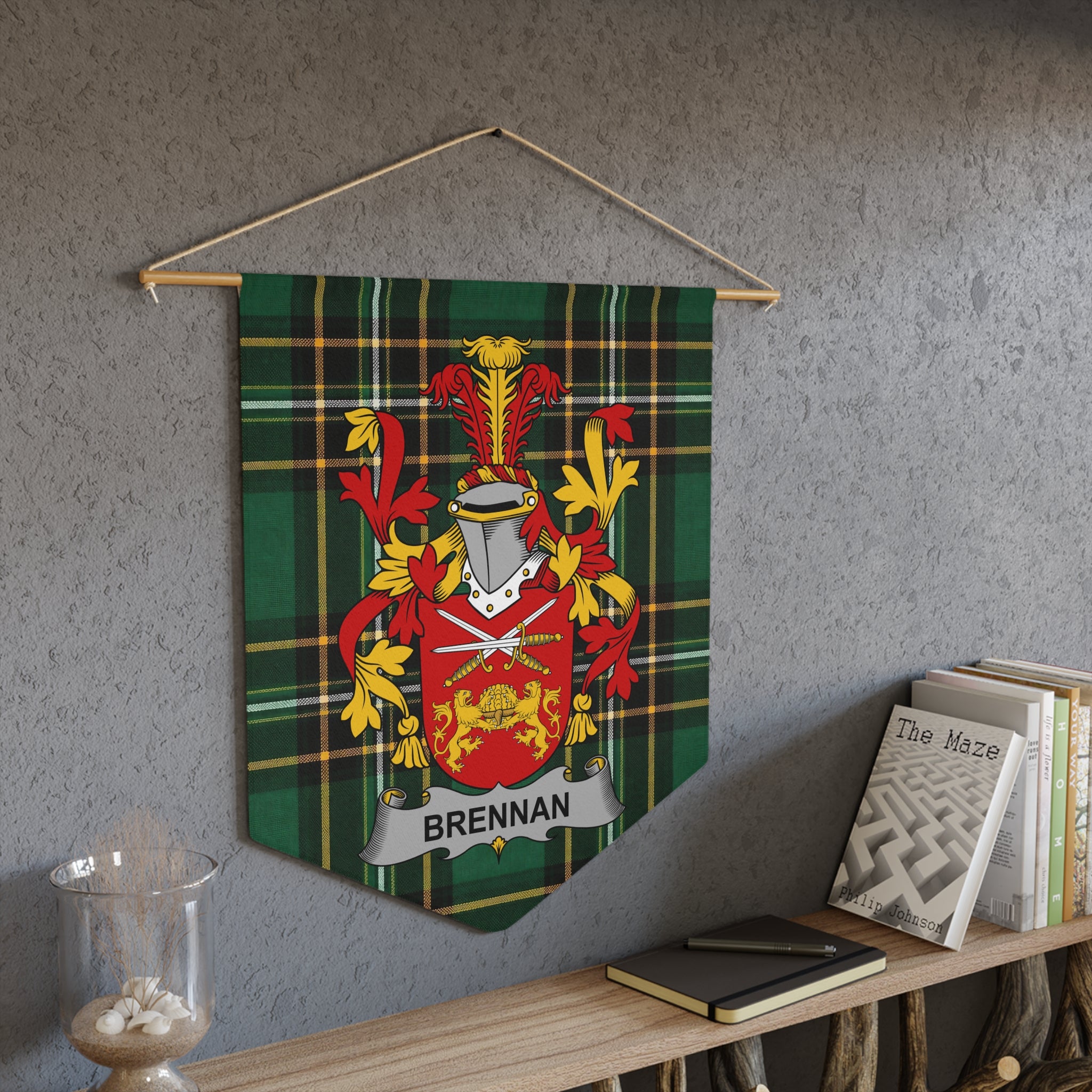 Brennan family crest on a green plaid banner hanging from a wooden rod.