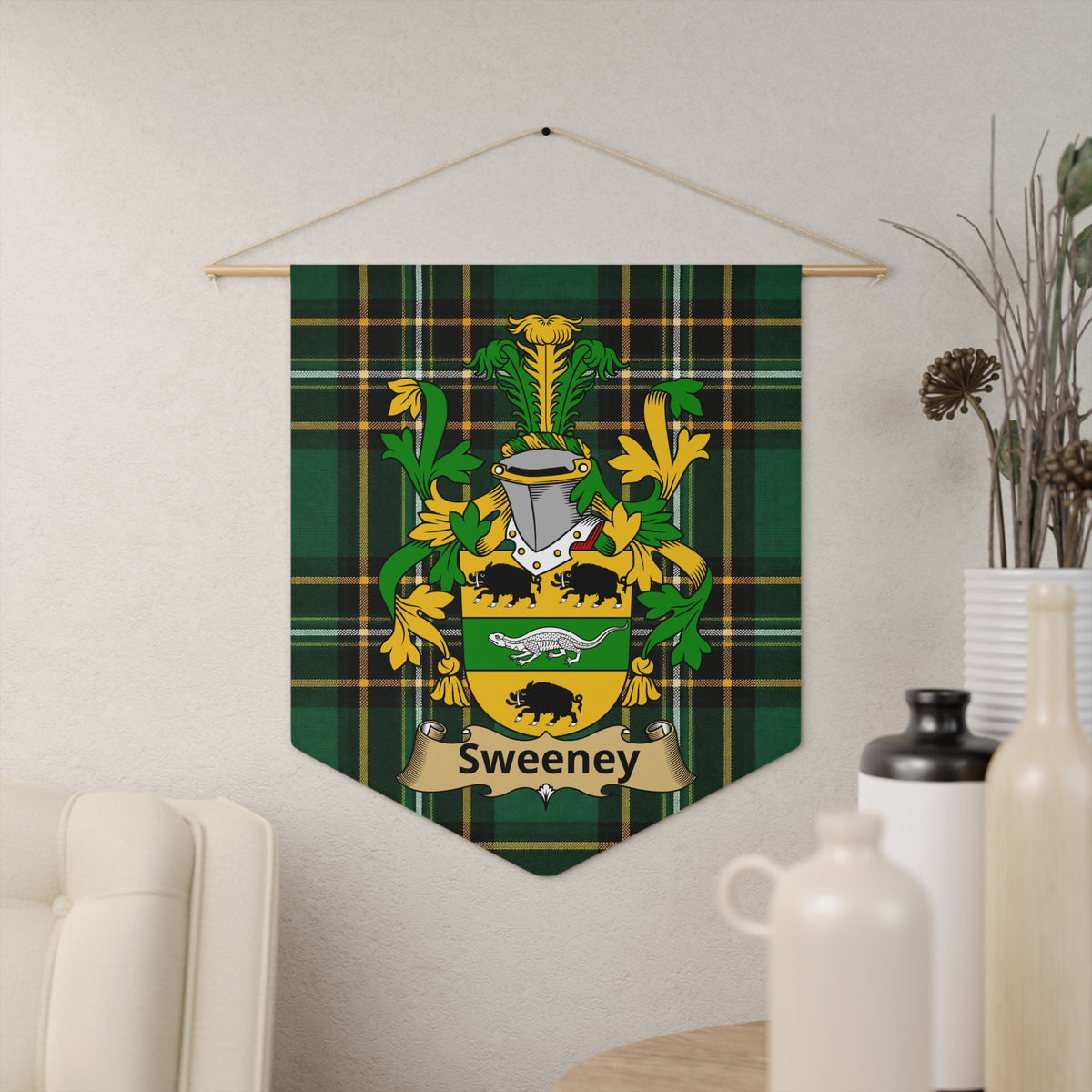 Sweeney family crest banner on green tartan, with a helmet and animals.