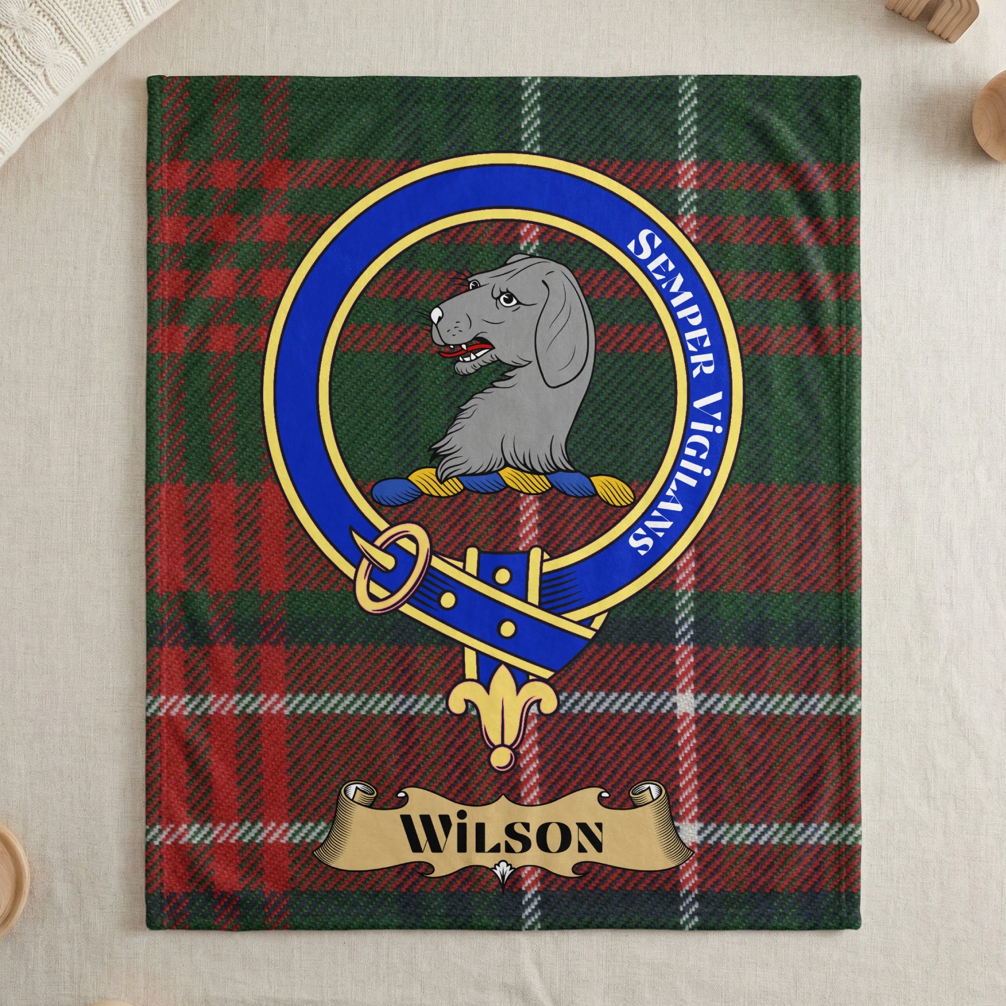 Wilson clan crest with hound on tartan throw blanket — draped display