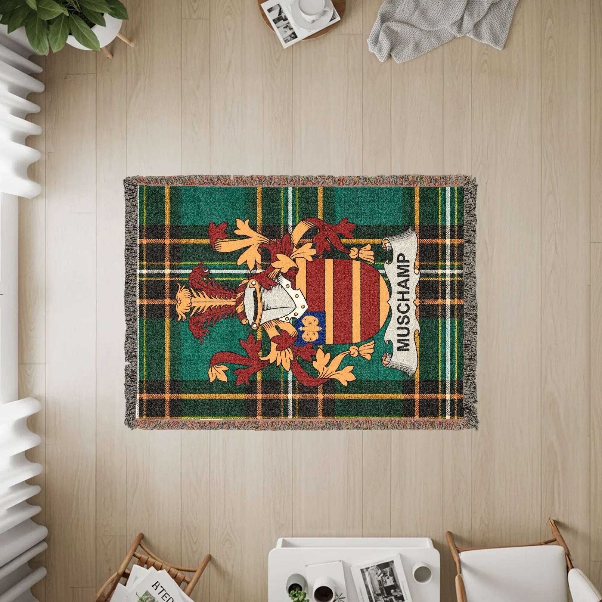 Green tartan throw blanket with Muschamp family crest and name.