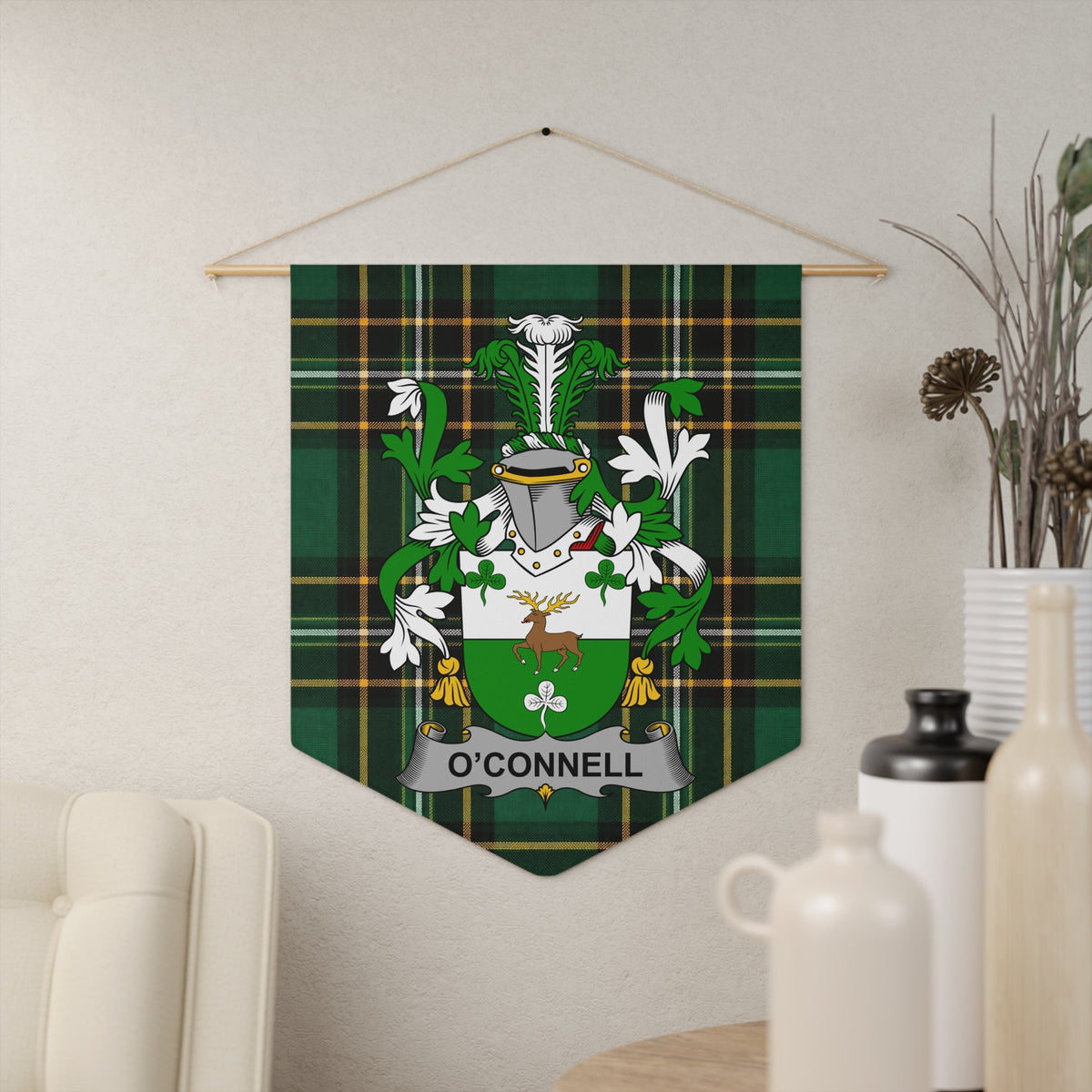 O'Connell family crest on green tartan banner hanging on wall.