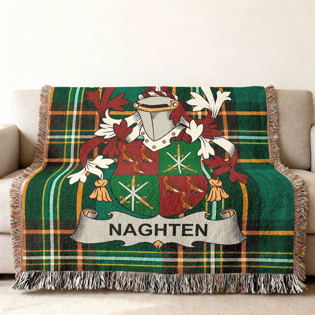 Green tartan throw blanket with Naghten family crest.