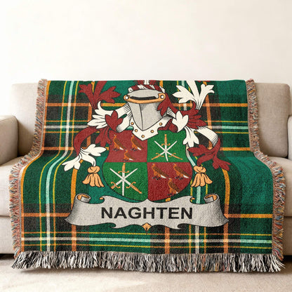 Green tartan throw blanket with Naghten family crest.