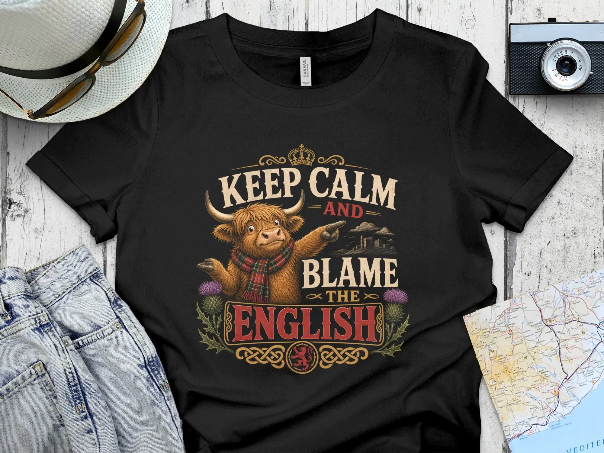 Black t-shirt with "Keep Calm and Blame the English" text and Scottish thistle design.