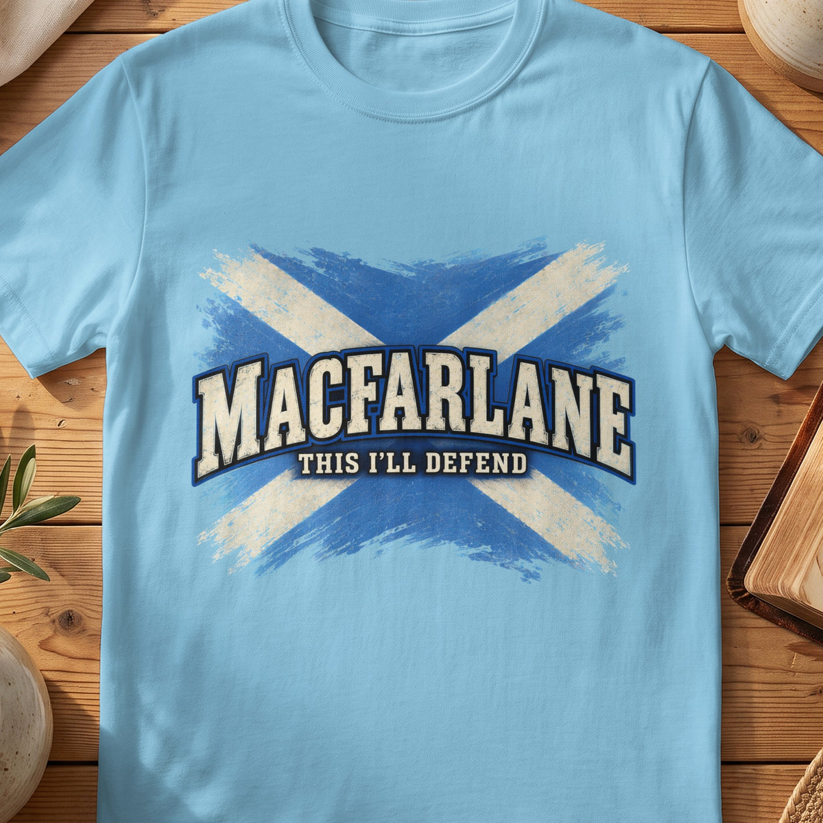 MacFarlane Scottish Saltire T-shirt in Sky, with distressed blue and cream flag and “This I'll Defend” lettering.
