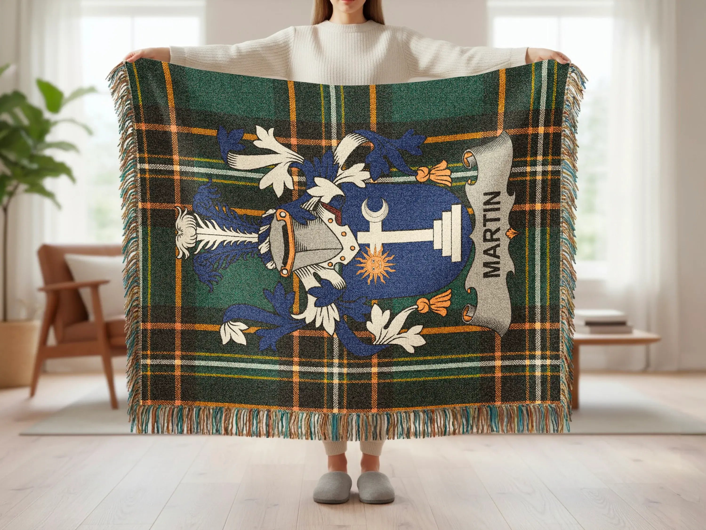 Green and blue tartan blanket with Martin family crest and fringe.