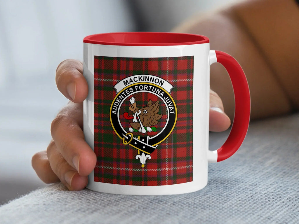 MacKinnon tartan crest mug in hand — showing full plaid wrap and coloured handle detail