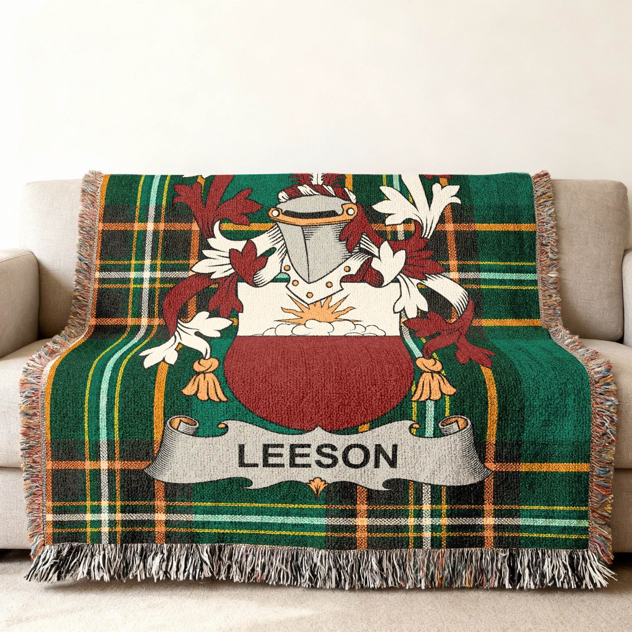 Green tartan throw blanket with Leeson family crest.