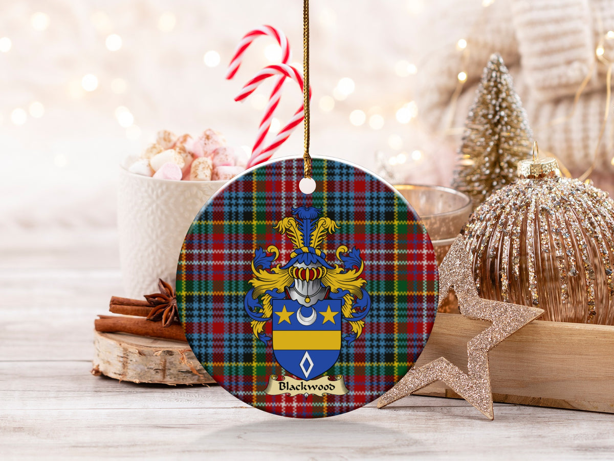 Blackwood family emblem ceramic Christmas ornament with Caledonia tartan background in festive holiday décor