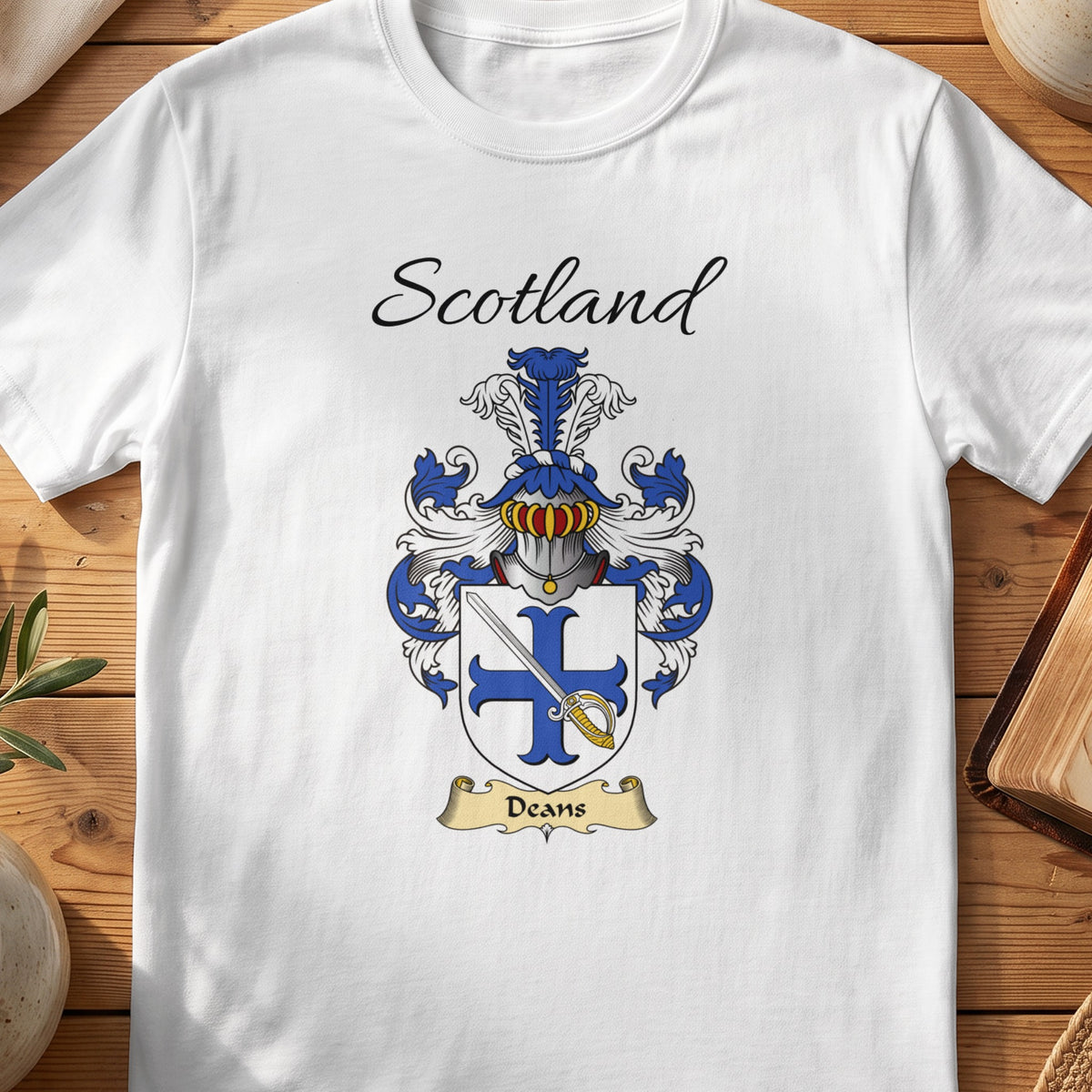 White Deans Scottish family shield T-shirt featuring a blue cross overlaid with a diagonal sword