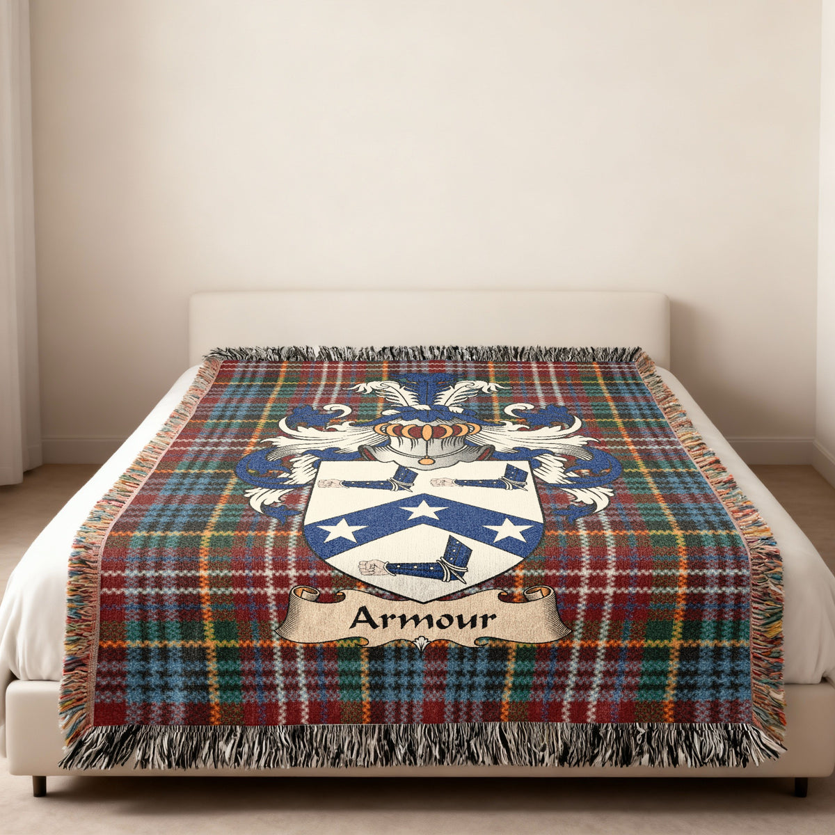 Armour family crest emblem on a Caledonia tartan woven blanket