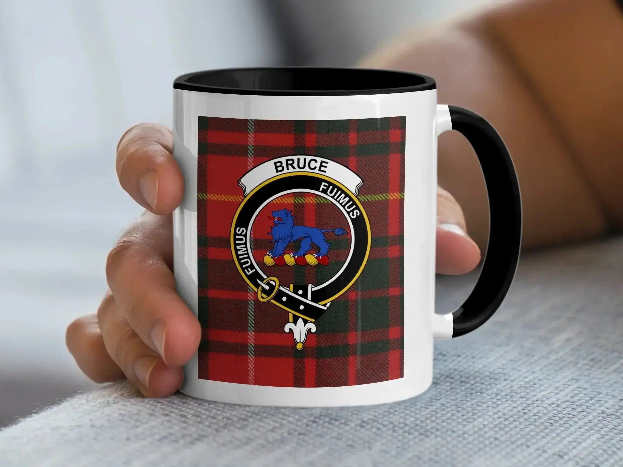 Close-up of Bruce clan crest on 11oz mug — blue lion and Fuimus motto, black handle accent