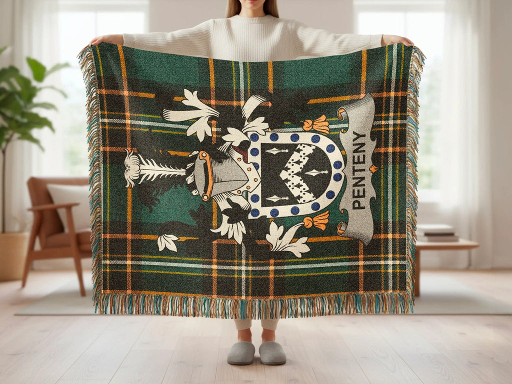 Green and black plaid throw blanket with a central coat of arms.