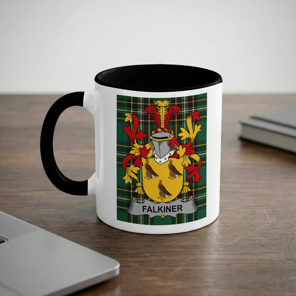 White mug with black rim featuring the Falkiner family crest on a wooden surface.