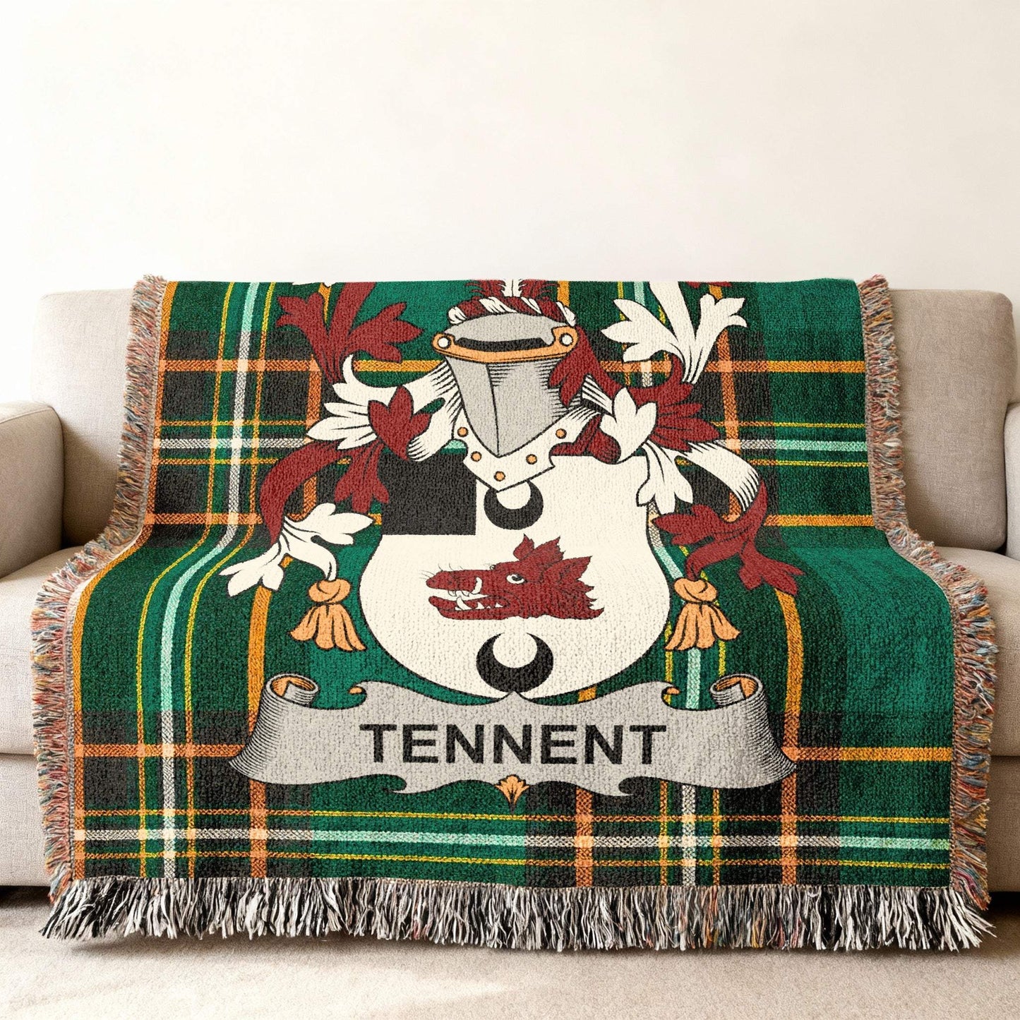 Green plaid throw blanket with Tennent family crest displayed prominently.
