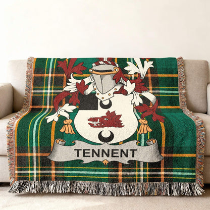 Green plaid throw blanket with Tennent family crest displayed prominently.