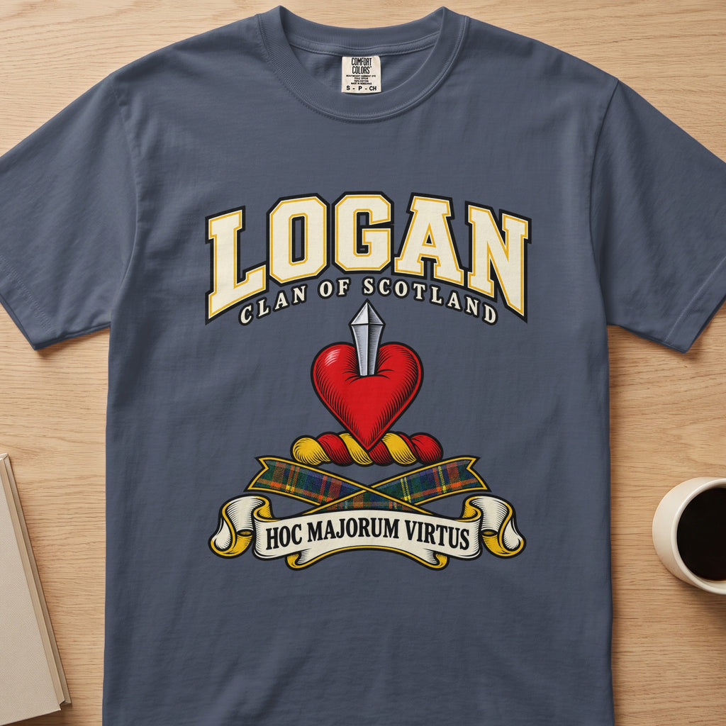 Logan clan crest with red heart and silver blade on a slate blue Comfort Colors T-shirt, front view