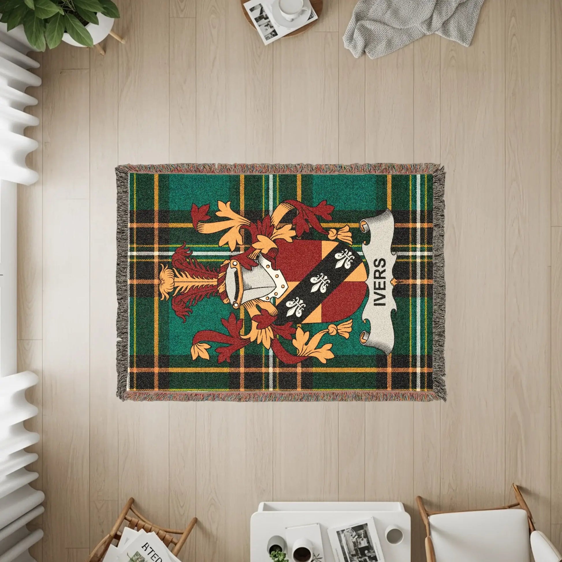 Green plaid woven throw blanket with Ivers family crest.