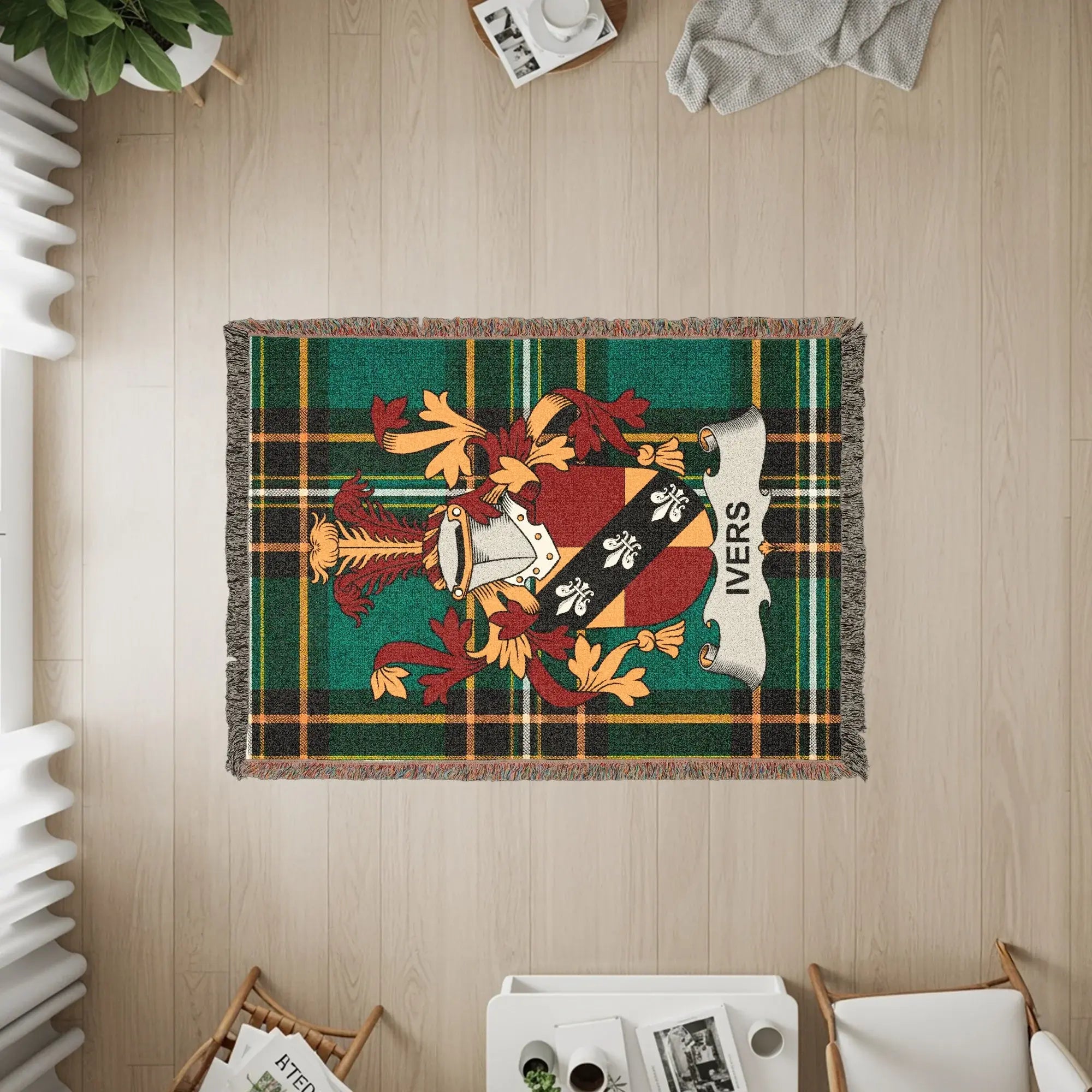 Green plaid woven throw blanket with Ivers family crest.