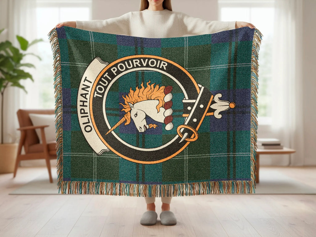Oliphant crest woven blanket in full — fringe edge and plaid pattern