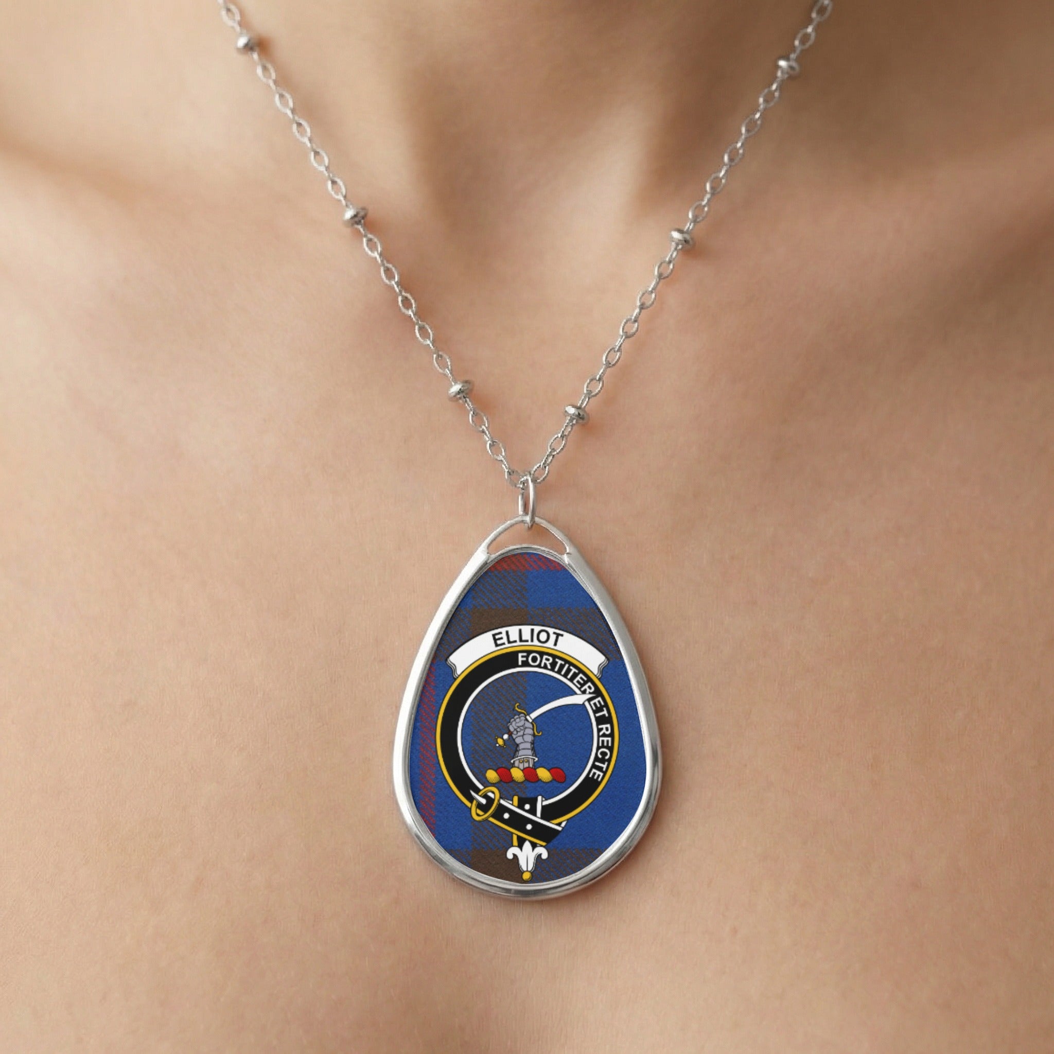 Close-up of Elliot clan tartan pendant necklace with crest design